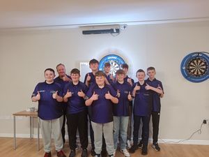 Supporting image for story: Darting starlets hit the bullseye in men's league