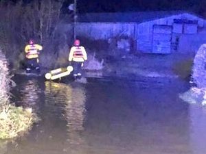 Supporting image for story: Woman and girl rescued from car trapped in flood water
