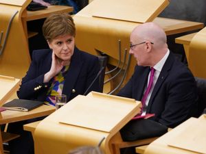 Nicola Sturgeon and John Swinney in Holyrood