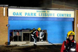 Firefighters cut their way through the roll-down door that covered the centre's entrance