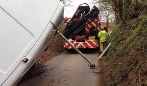 A pole is put in place to prevent the van tipping further. Photo: @SFRSWellington