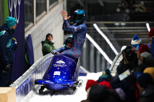 Pilot Adele Nicoll, rear, and Ashleigh Nelson of Team Great Britain celebrate after competing in the Bobsleigh Two-Woman Heat 4 on day fifteen of the Milano Cortina 2026 Winter Olympic games at Cortina Sliding Centre on February 21, 2026 in Cortina d'Ampezzo, Italy. (Photo by Richard Heathcote/Getty Images)
