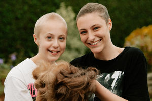 Lula Pattison, 14, and friend Sian Robson, 14, from Shrewsbury, shaved their heads to raise money for Severn Hospice
