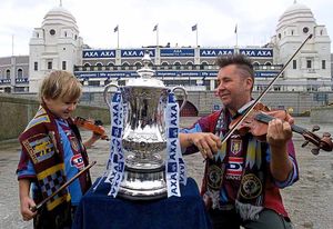 Nigel with the FA Cup in his Villa shirt outside the old Wembley Stadium with then-four-year-old son Sark ahead of the 2000 Cup Final v Chelsea