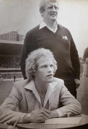 Andy Gray signing on the dotted line after Wolves broke the British transfer record to sign him from Aston Villa.