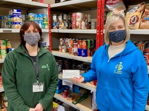 Supporting image for story: Rotary Club donates to food bank 