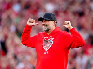 Former Liverpool manager Jurgen Klopp wears a hoodie with the words 'Thank You Luv' on the front