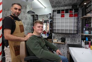 Owen Norgrove with Barber Firat Davutoglu atTurkish Barber in Ludlow, Shropshire. Barber Firat saved customer's Owen's life after finding lump on his neck that turned out to be Hodgkin Lymphoma cancer. Owen is in remission now
