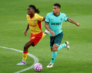 WALSALL, ENGLAND - JULY 30: Wolverhampton Wanderers Joao Gomez and RC Lens Fode Sylla in action during the pre-season friendly match between Wolverhampton Wanderers and RC Lens at Pallet-Track Bescot Stadium on July 30, 2025 in Walsall, England. (Photo by Carl Recine/Getty Images)