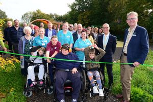 Representatives from the hospice, Greenfingers and all the funders and construction teams cut the ribbon