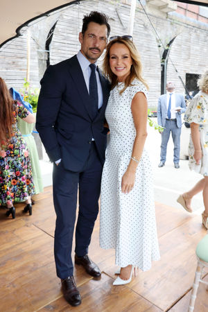 LONDON, ENGLAND - JULY 14: David Gandy and Amanda Holden during Queen Camilla's visit to unveil the new RHS and BBC Radio 2 'Dog Garden', designed by Monty Don at Battersea Dogs & Cats Home on July 14, 2025 in London, England. (Photo by Chris Jackson/Getty Images)