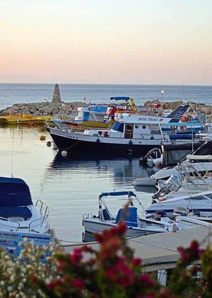 The day draws to a close, with boats in the harbour