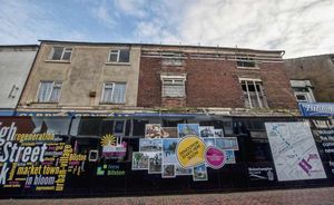 One of the derelict buildings in High Street, Bilston, being demolished as part of the Urban village project