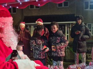 Children lined up to get a little gift from Santa and tell him what they were hoping to get for Christmas this year. 