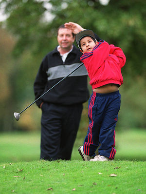 Four year old Aaron Rai hits another 100 yard shot at Three Hamers Golg course watched Gary Gilligan.