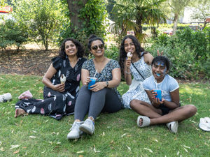 Spectators cool off in the shade with ice cream and slushies Credit: Ian Knight / Z70 Photography