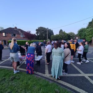 The teens were welcomed over the finish line by a group of family, friends and school staff