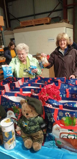 Volunteers work to fill the bags