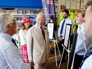 Supporting image for story: King asks if RNLI volunteers ‘get a lot’ of small boats call outs during visit