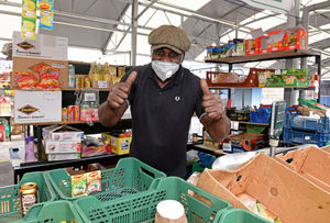 Trader Jeremy Watson gives the thumbs up to the reopening of the market