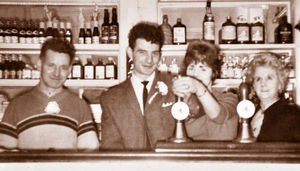 Harry, pictured on the left, in his pub the Globe