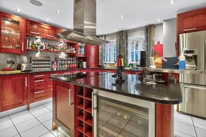 The modern kitchen is built for both style and practicality, forming a key part of the home’s social space