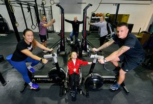 A triathlon on machines being organised at Ore Fitness Community to raise money for Olivia Jukes-Jones 5, as she needs an operation. At the front is Olivia with Emily Wan Min Kee (left) and Olivias dad, Lewis Jukes-Jones (right). Back is Gym owner: Adam Kudryl, Lee Delves and Charlie Gregory