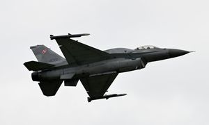 An F-16 Fighting Falcon soars above the airfield in Cosford