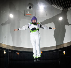 An iFly coach at The Bear Grylls Adventure in Birmingham recreates an iconic Toy Story flying scene as Buzz Lightyear