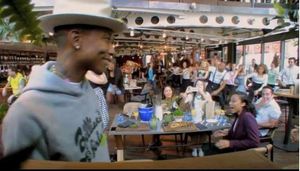 Pharrell Williams in a restaurant in London with a flashmob (of diners, waiters and bar staff) dancing to the track 'Happy'