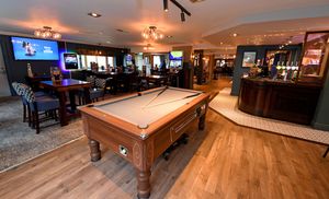 The pub has different areas for customers to enjoy a drink, a game of pool or a football match