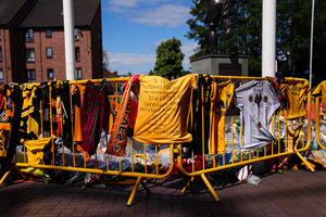Shirts and scarves cover the fences around the Billy Wright statue