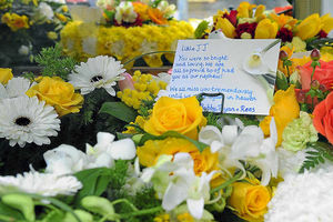 Poignant words on a poetry tribute with these flowers at Jayden's funeral today