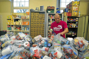 Jake Bennett, from Telford Food Bank, as he parcels up food for hundreds of needy people in the borough