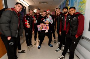 Walsall FC players visit Walsall Manor Hospital.Players with Jay Wright andf daughter Eilana-Jai Wright, aged 2.