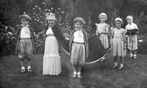 Wayne, left, was a page boy attending the "Queen," Margaret Passey.