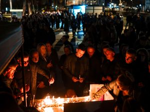 People light candles in the town of Kocani