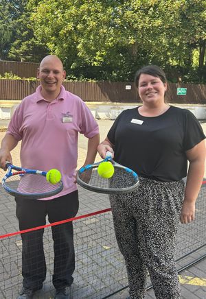 Activities Coordinator Scott and Admin Assistant Bethany ready to game, set, match!