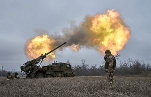 Ukrainian soldiers fire a French-made Caesar self-propelled howitzer