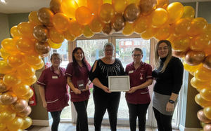 The team celebrate their award 