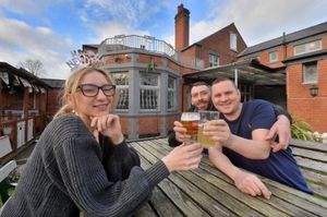 Warm enough to enjoy a pint outside at the Newhampton pub in Wolverhampton. Pictured are Pria Sandhu, James Farthing and Tom Wilson