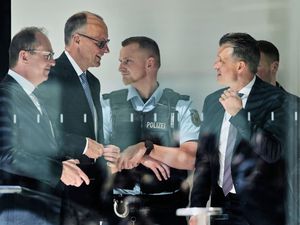Leader of the Christian Democrats Friedrich Merz, centre, Alexander Dobrindt of the Christian Social Union left, and CDU faction leader Thorsten Frei, right