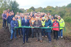 The ribbon was officially cut on the Greenway by Councillor Keith Vernon, Chair of Lichfield District Council, joined by Councillor Doug Pullen and Councillor Janice Silvester-Hall, while Back The Track volunteers, councillors and guests looked on.