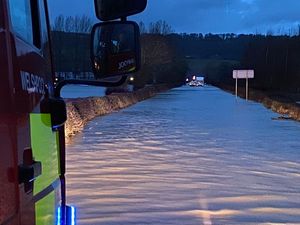 Supporting image for story: Rescue mission after two vehicles left stranded in flood water near Welshpool Airport