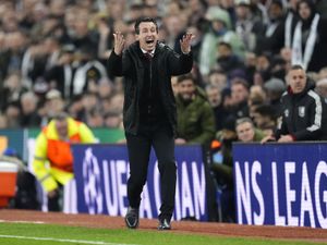Unai Emery shows his frustration on the touchline in front of a Champions League hoarding during Aston Villa's clash with Paris St Germain