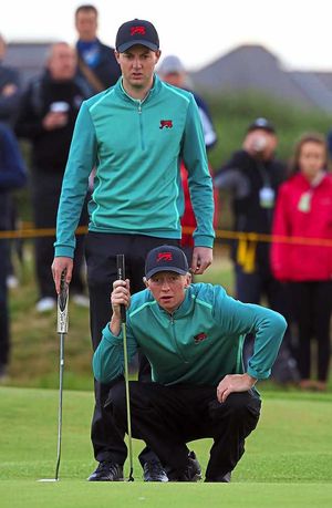 Lining up a putt with Jamie Mullen during the Walker Cup fourballs at Royal Lytham & St Annes