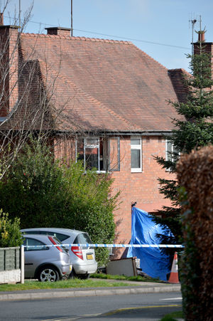 A blue forensic tent could be seen outside one of the houses in the road