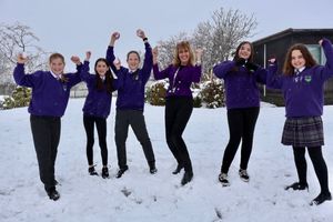 Head Sue Lovecy celebrates the Good reating with pupils