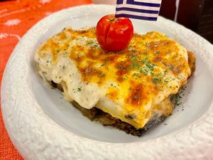 Supporting image for story: We discovered deliciously authentic Greek cuisine in a lively Birmingham neighbourhood with a special dish covered in honey