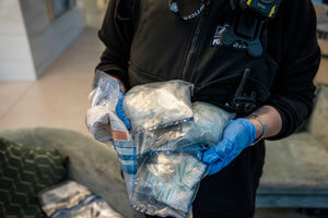 Items seized after Metropolitan Police officers carry out a dawn raid in Canary Wharf, London, as they execute a warrant as part of an investigation into a County Lines drug gang. Photo: PA Wire